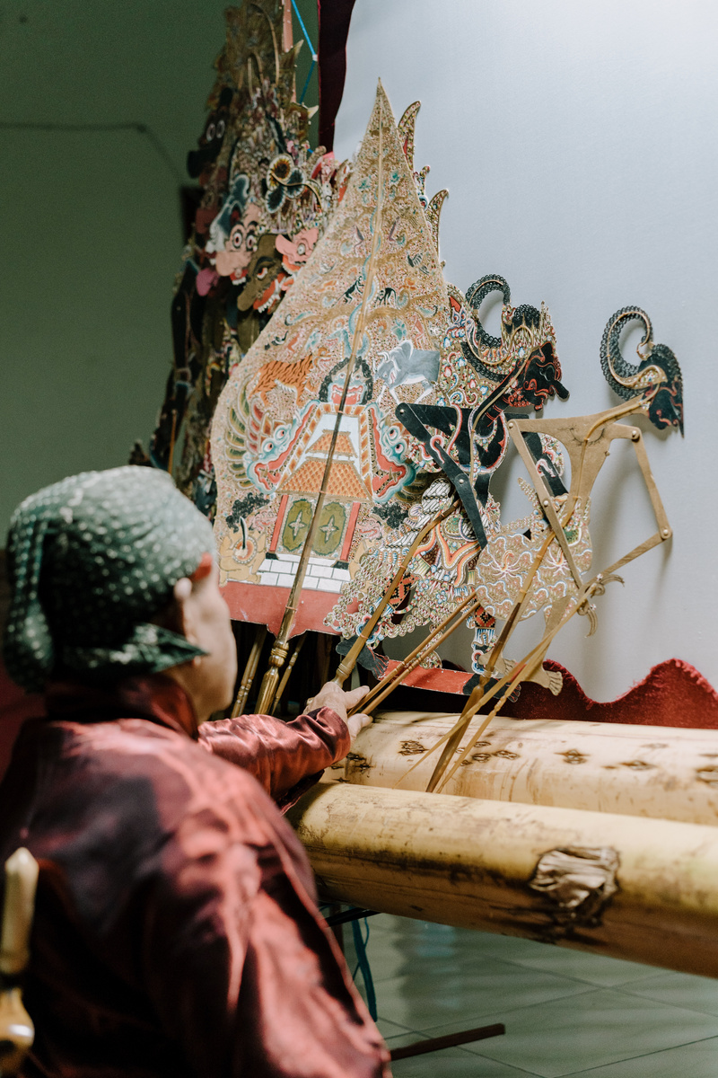 Man Making Traditional Wayang Puppets